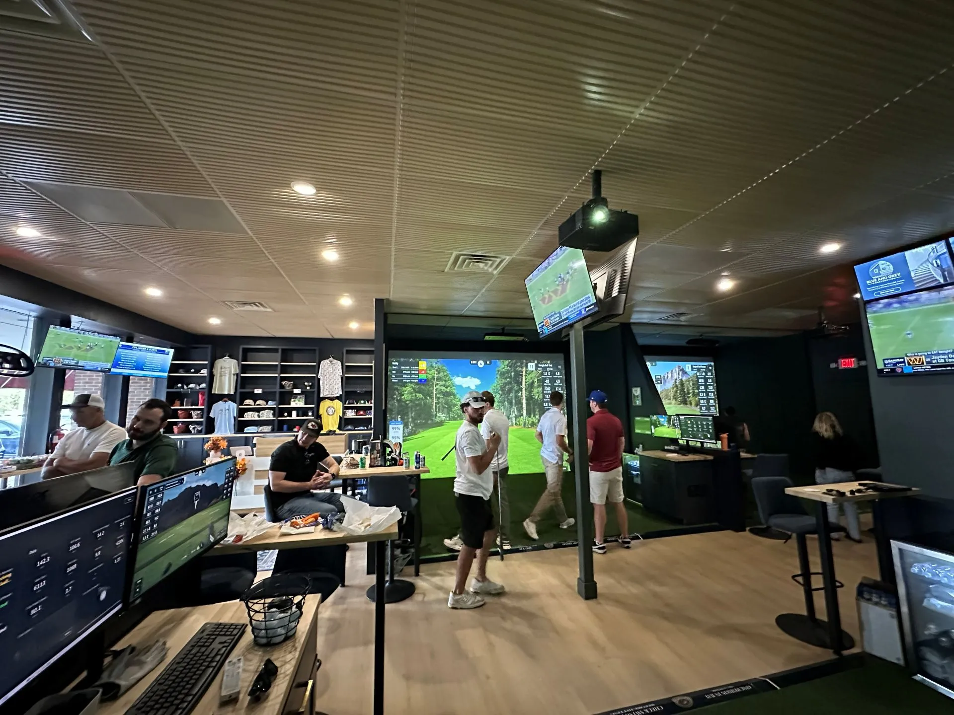 Bachelor party group celebrating with indoor golf and BYOB drinks at All Seasons in Kansas City